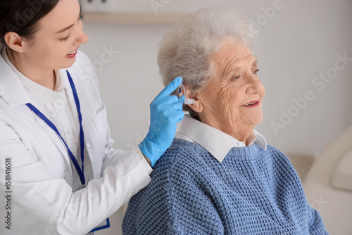 Female doctor putting heari...