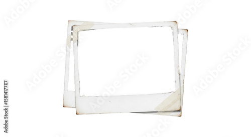 Two blank vintage instant film frames stacked with aged paper edges and a black background creating a retro photo album effect