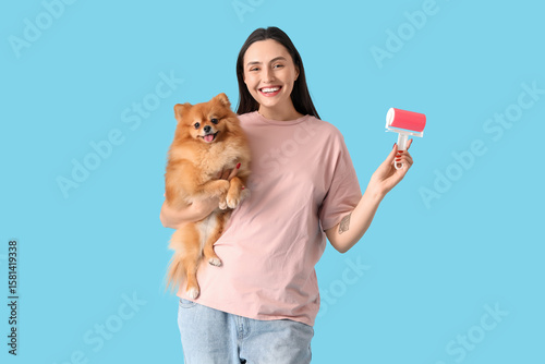 Young woman with fluffy dog...