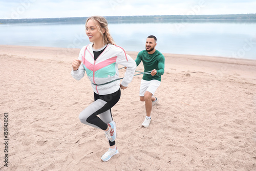 Sporty young couple doing e...