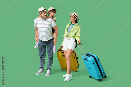 Family of tourists with sui...