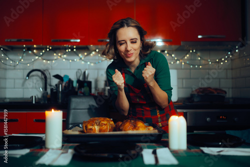 Happy Woman Excited She Got the Baked Turkey Perfectly. Perfectionist housewife cooking the holidays dinner at home