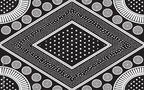 Abstract black and white geometric pattern with repeating spiral and dot design