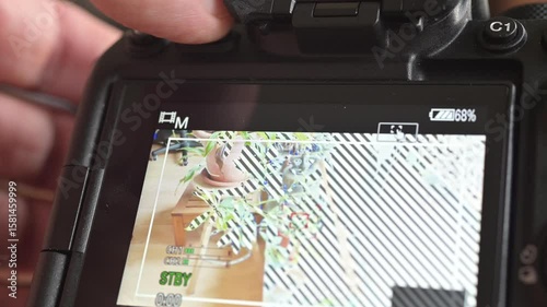 Close up of photo video camera in action