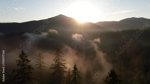 Aerial view of mountains and forest with fog at sunrise nature landscape travel background scenic 4k