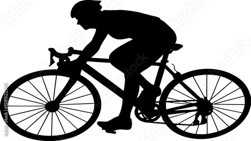 Silhouette of a cyclist wearing a helmet riding a bicycle on a flat road in a race or competition