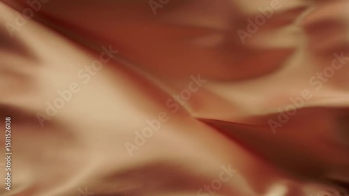Smooth peachy-orange silk fabric folds