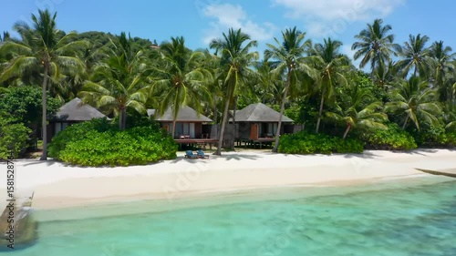 Tropical beach resort with cabanas