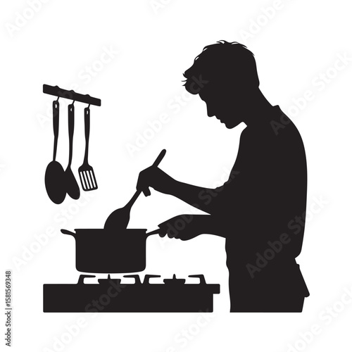 Silhouette of a young man cooking at a stove stirring a pot with a ladle kitchen utensils hanging nearby