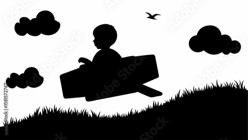 Silhouette of child in cardboard airplane flying over grassy hill with clouds and bird in the sky scene