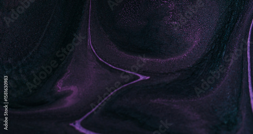 Paint splash. Chemical texture. Defocused purple color flowing pigment liquid emulsion floating on abstract creative art background.