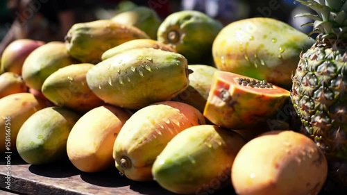 Pile of fresh tropical fruits with papaya and pineapple