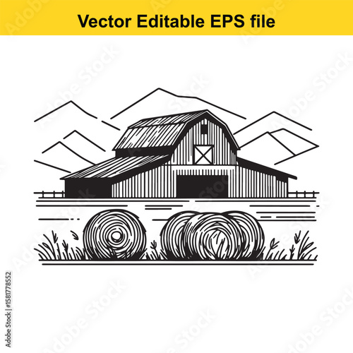 A barn with hay bales against a mountain backdrop