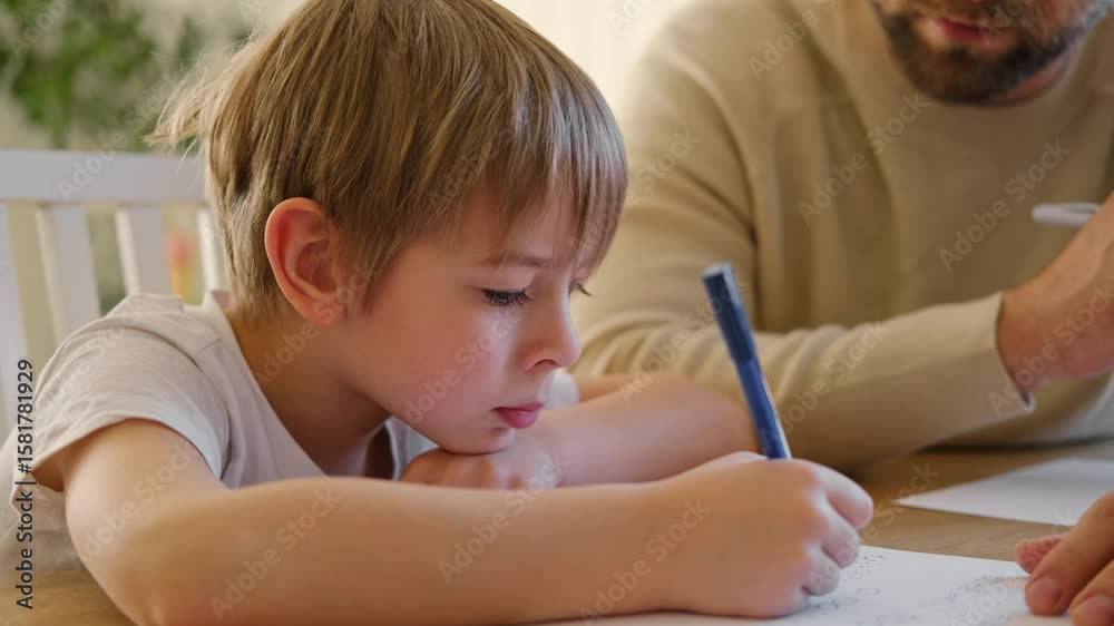 Dad teaches his son writing and counting. Kids primary education. Children learn, study in home school. Daddy male helping teaching little child boy support studying, learning homework. Knowledge day. Dad teaches his son writing and counting. Kids primary education. Children learn, study in home school. Daddy male helping teaching little child boy support studying, learning homework. Knowledge day.