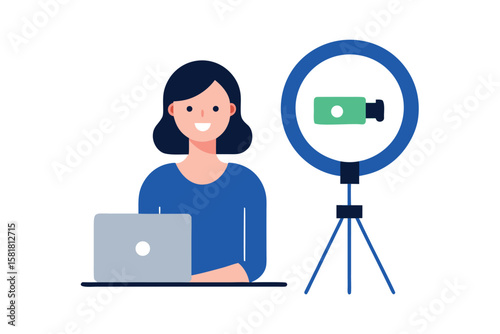 Woman working on laptop with ring light and camera for content creation
