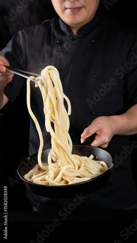 Chef Tossing Stir-Fry with Colorful food ingredients in a Pan
