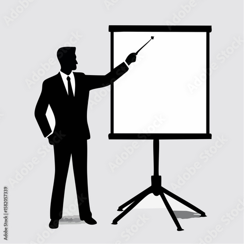 Silhouette of a businessman presenting with pointer at a presentation board