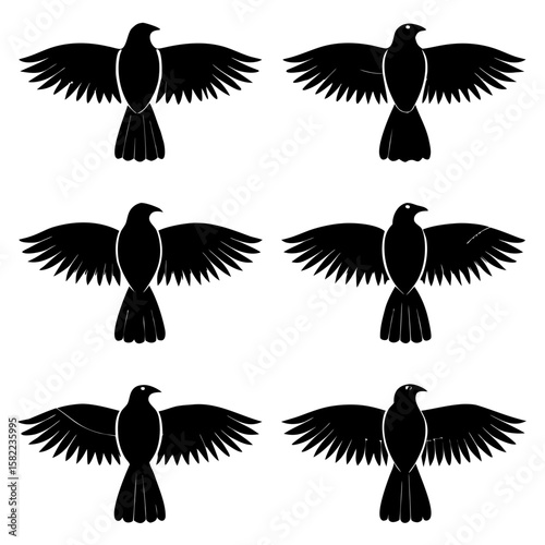 Black silhouette birds flying in formation wings spread