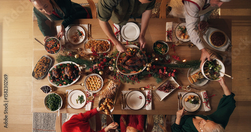 Принти на полотні Festive, meal and people in home, dinner and celebration of Christmas with food at night or reunion