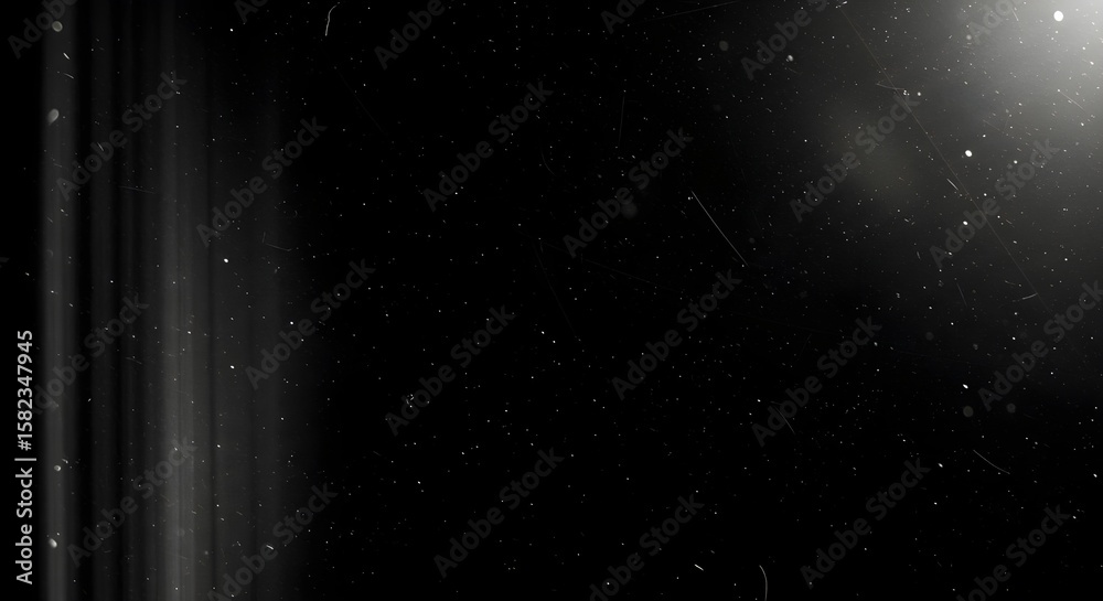 Obraz premium Abstract dark background with light leaks, dust particles, and cinematic grunge texture