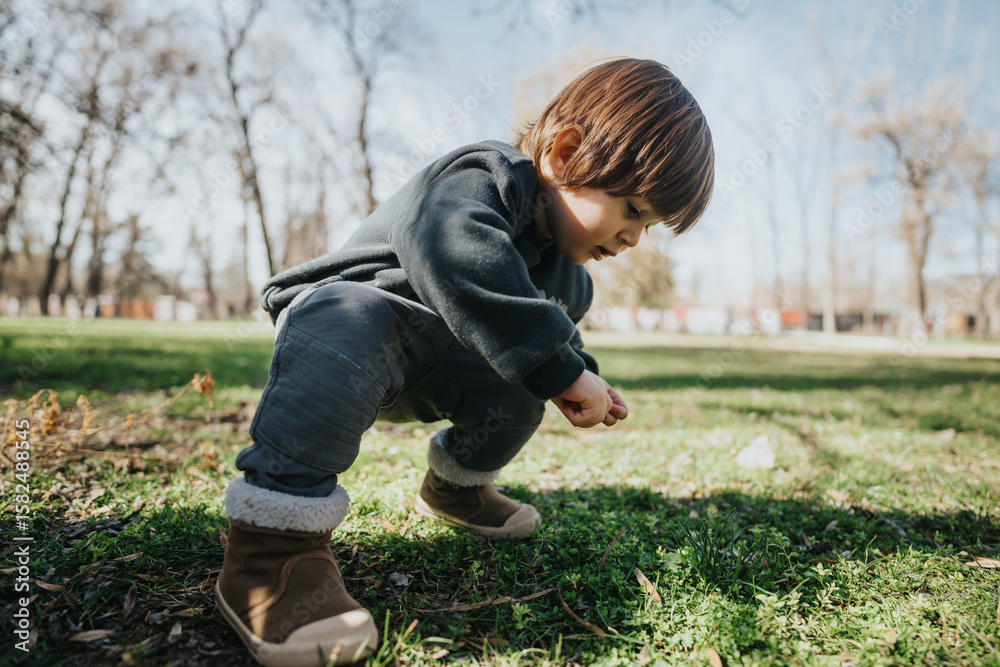 A child engages in play and exploration on a sunny day in a scenic outdoor park. The scene captures natural light, lively interaction with nature, and the joy of discovery. A child engages in play and exploration on a sunny day in a scenic outdoor park. The scene captures natural light, lively interaction with nature, and the joy of discovery.
