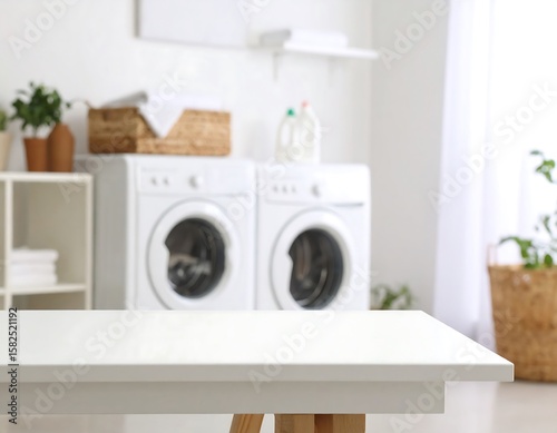 Laundry room with white table