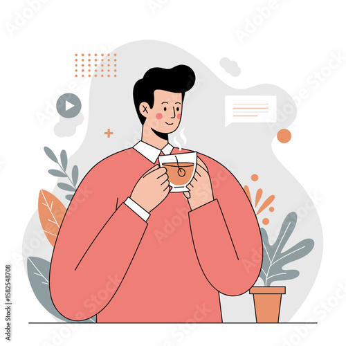 Young man enjoying a hot drink while standing in a cozy room  