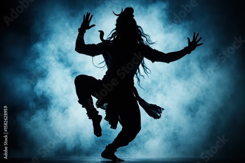 Isolated silhouette illustration of Shiva Nataraja, the cosmic dancer, against a vibrant smoky blue background, embodying divine energy and transformation.