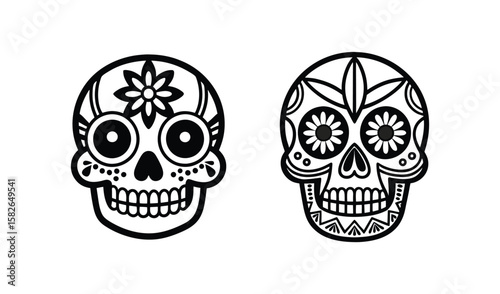 Two decorative black and white sugar skulls with floral and geometric patterns