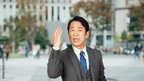 Photos Man giving a speech in the street, street speech, politician