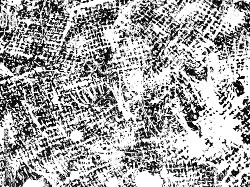 Footprint pattern on a textured surface in black and white during daylight hours