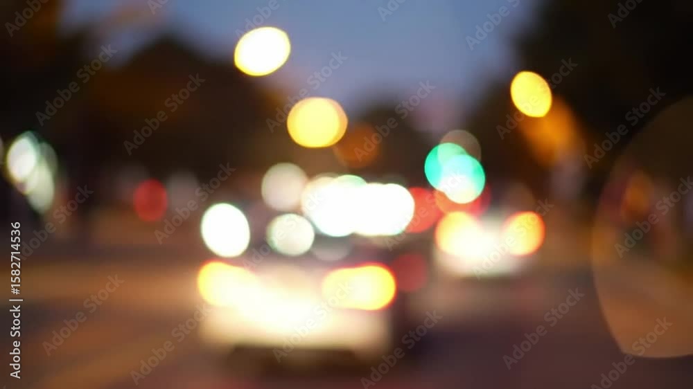Blurry city lights at night with bokeh effect creating a dreamlike atmosphere view