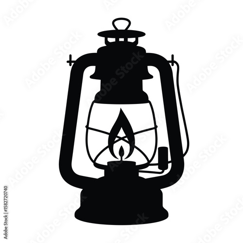 Silhouette of a vintage kerosene lantern with a glowing flame inside