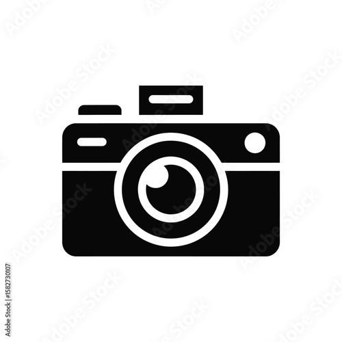 Simple black and white icon of a vintage camera with a lens and flash