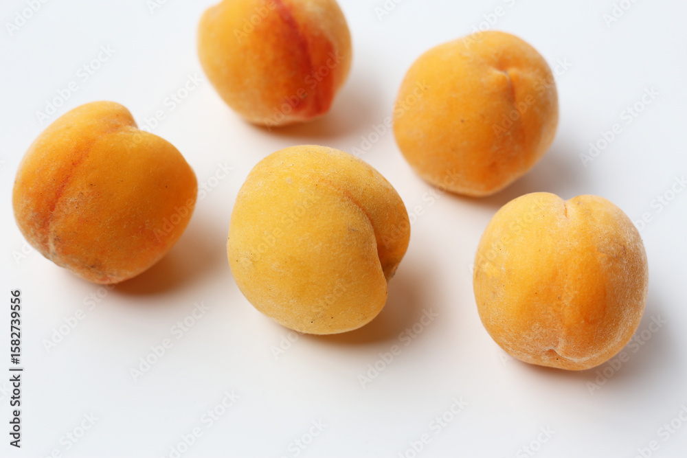 Fresh ripe apricots on a white background. Fresh ripe apricots on a white background.