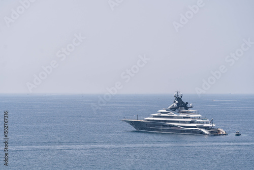 Luxury superyacht anchored in calm Mediterranean sea — symbol of wealth, exclusivity and high-end travel lifestyle on the French Riviera