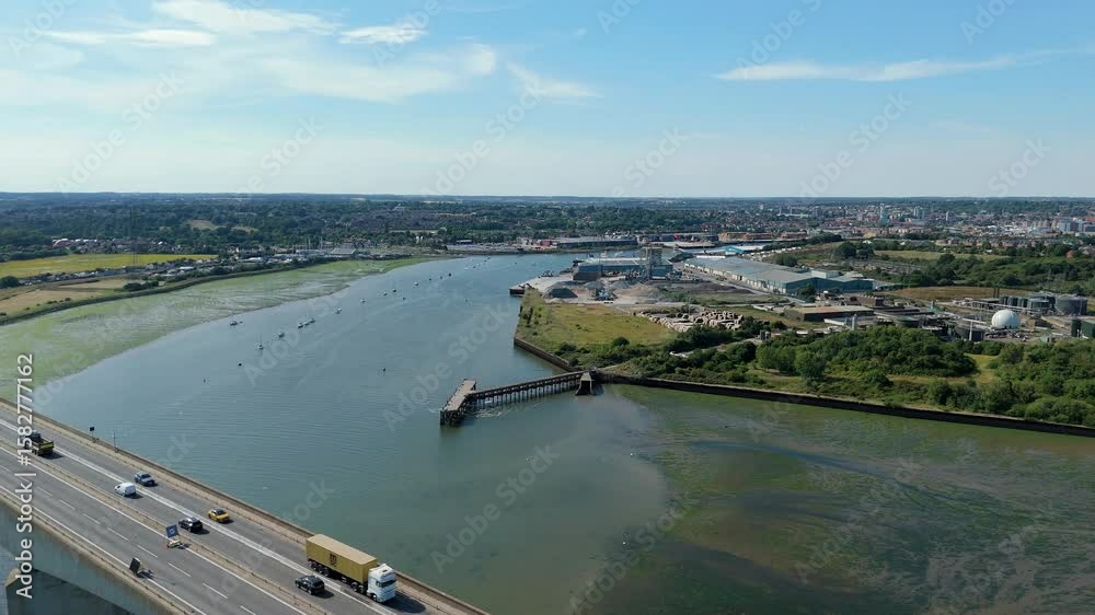 Aerial drone view of Orwell bridge crossing River Orwell, the Strand, Freston, wetland habitat near Ipswich with heavy traffic in England sunny summer day Aerial drone view of Orwell bridge crossing River Orwell, the Strand, Freston, wetland habitat near Ipswich with heavy traffic in England sunny summer day