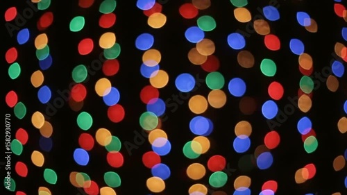 Bokeh lights blurry colorful spots on black