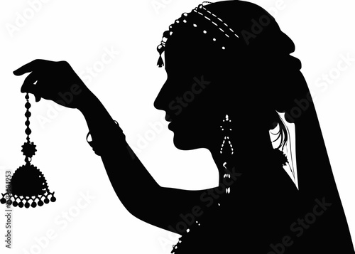 Silhouette of Woman Holding Traditional Jewelry