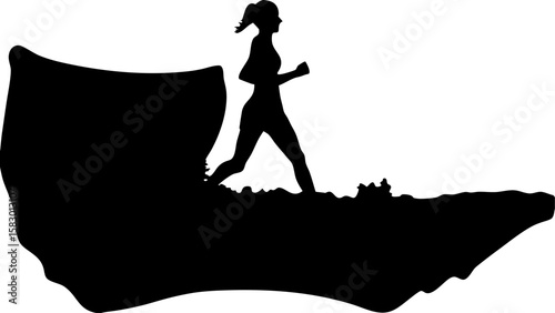Silhouette of a woman running on a rocky terrain with a large rock formation in the background in black and white