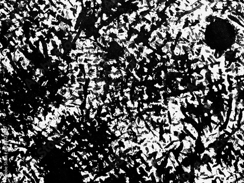 Black and white abstract texture featuring chaotic patterns and contrasting lines in a dynamic composition