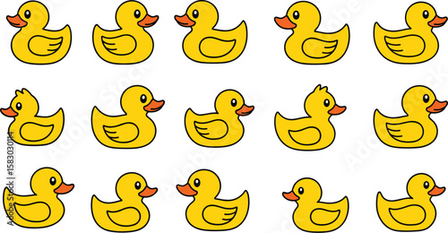 Collection of cartoon rubber duckies on blue background. Pattern, background, design, kids, toys, bath, symbol, yellow, cute