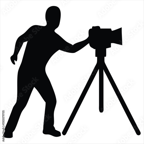 A black silhouette of a person operating a camera on a tripod, isolated on a white background