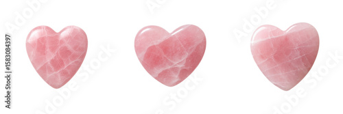 Three pink rose quartz heart stones polished and aligned