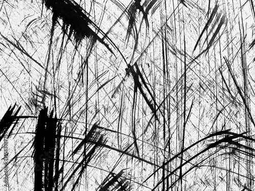 Abstract black and white texture with dynamic lines created by scratches on a surface