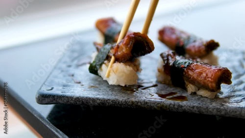 Eel fish sushi, sashimi Nigiri Platter, japanese sushi restaurant, Fresh Tuna and Salmon Slices in modern cafe, traditional food, raw red fish dish, omega 3. High quality 4k footage