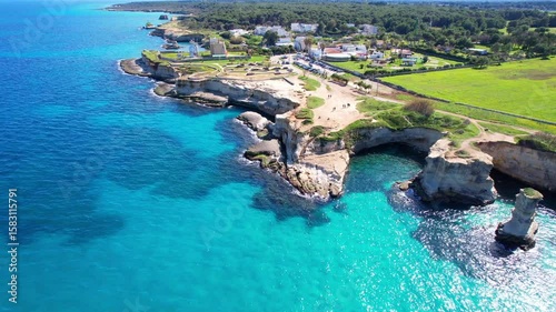 Faraglioni di Sant'Andrea - Torre Sant'Andrea, Salento, Lecce, Apulia, Italy - falling aerial photograph along the coastline