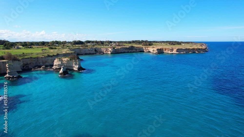Faraglioni di Sant'Andrea - Torre Sant'Andrea, Salento, Lecce, Apulia, Italy - rising aerial shot with stunning view over the coastline