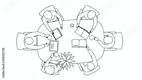 Overhead view of six people sitting around a table with books and coffee cups in a meeting setting