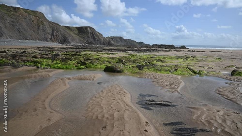 Low tide on a summers day at Sandymouth beach in Cornwall